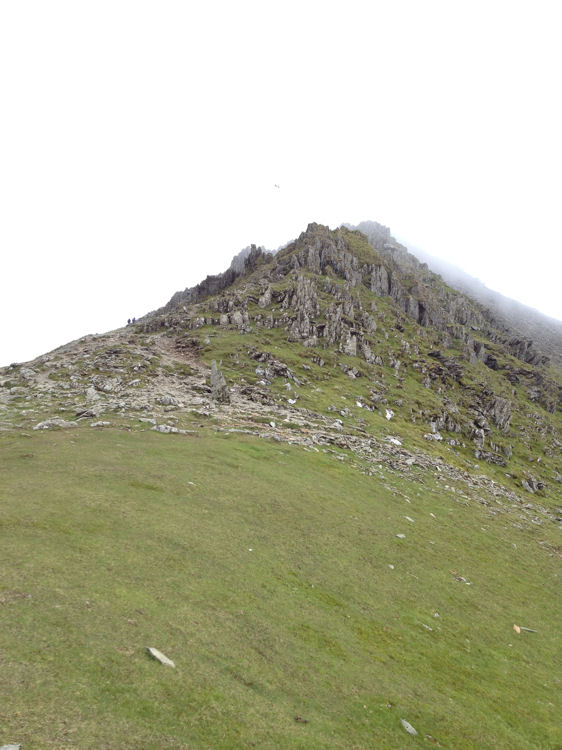 The standing stone at the top of Bwlch Main and the path to the summit
