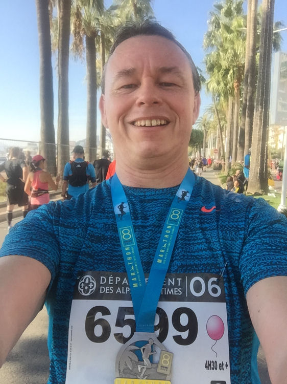 French Riviera Marathon finisher on La Croisette, Cannes