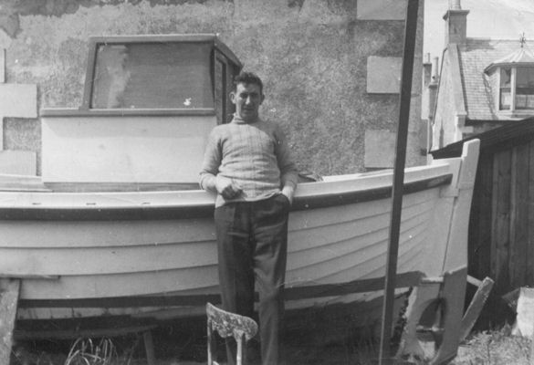 William's friend, James Flett Wood, visits the completed boat in the back yard William's friend, James Flett Wood, visits the completed boat in the back yard