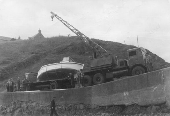 William's boat arrives at Portknockie Harbour on the back of a lorry William's boat arrives at Portknockie Harbour on the back of a lorry