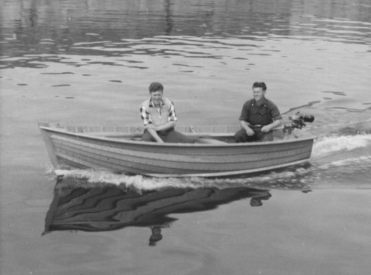 Testing the dinghy with an outboard motor in Portknockie Harbour Testing the dinghy with an outboard motor in Portknockie Harbour
