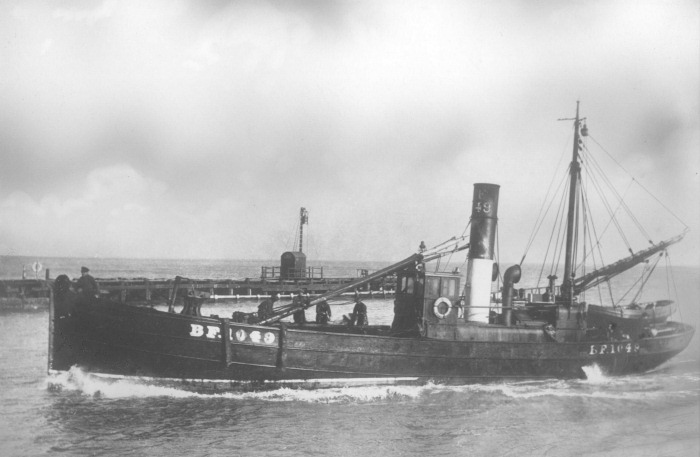 The Steam Drifter 'Trident' BF 1049 at Great Yarmouth with Alexander Pirie standing at the bow