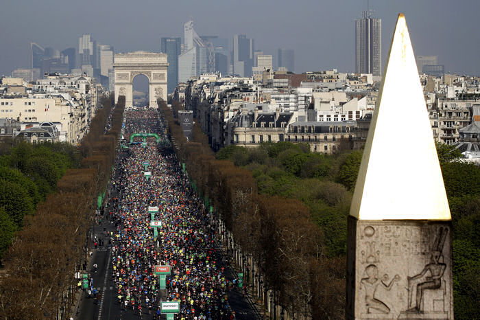Runners on their way down the Champs Elysée, and the tip of the Luxor Obelisk at the Place de la Concorde