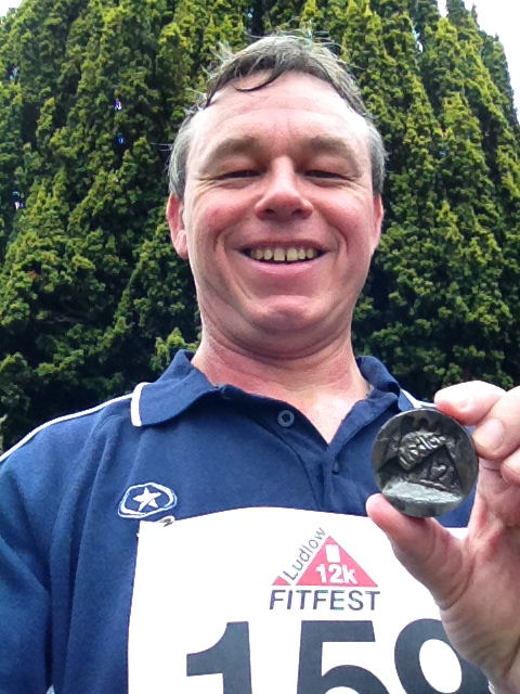 Neil with Ludlow 12k finisher's Coin