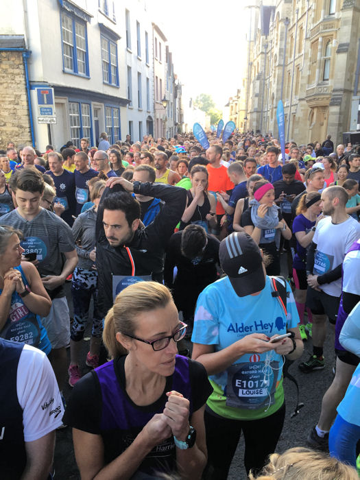 Runners fill the streets of Oxford in their starting pens