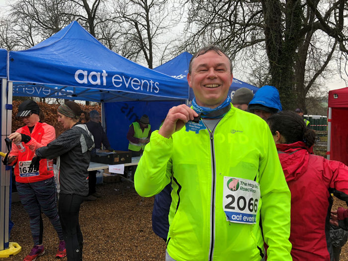 A very soggy finisher with medal