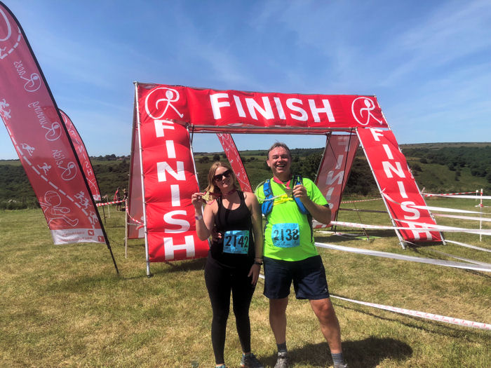 Tahni and Neil with their Cheddar Gorge Half Marathon medals